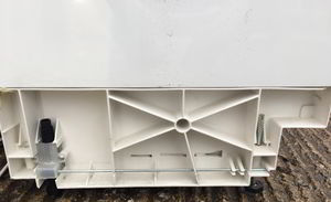 Lower the back feet on washing machine